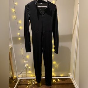 black fashionnova jumpsuit,with thumb holes, mock neck, bodycon, size M